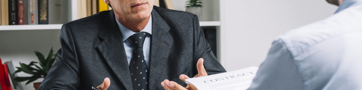 mature-lawyer-discussing-contract-with-client-courtroom