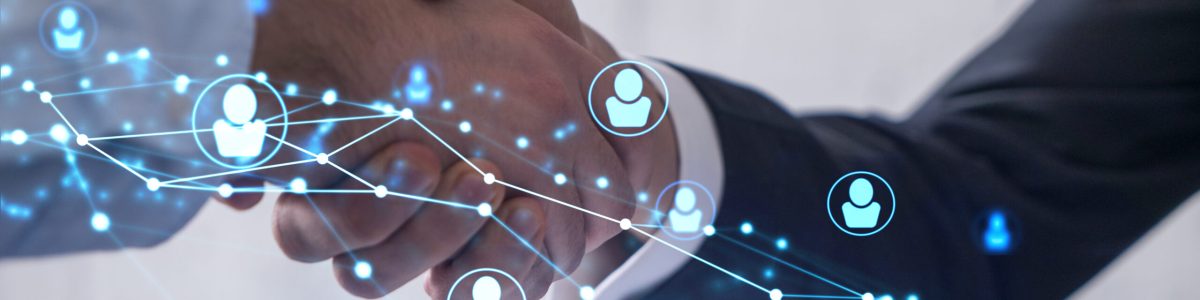 Recruitment concept to hiring of a new talented specialists for international company. Handshake to sign in of employment agreement. Social media hologram icons over the table with documents.